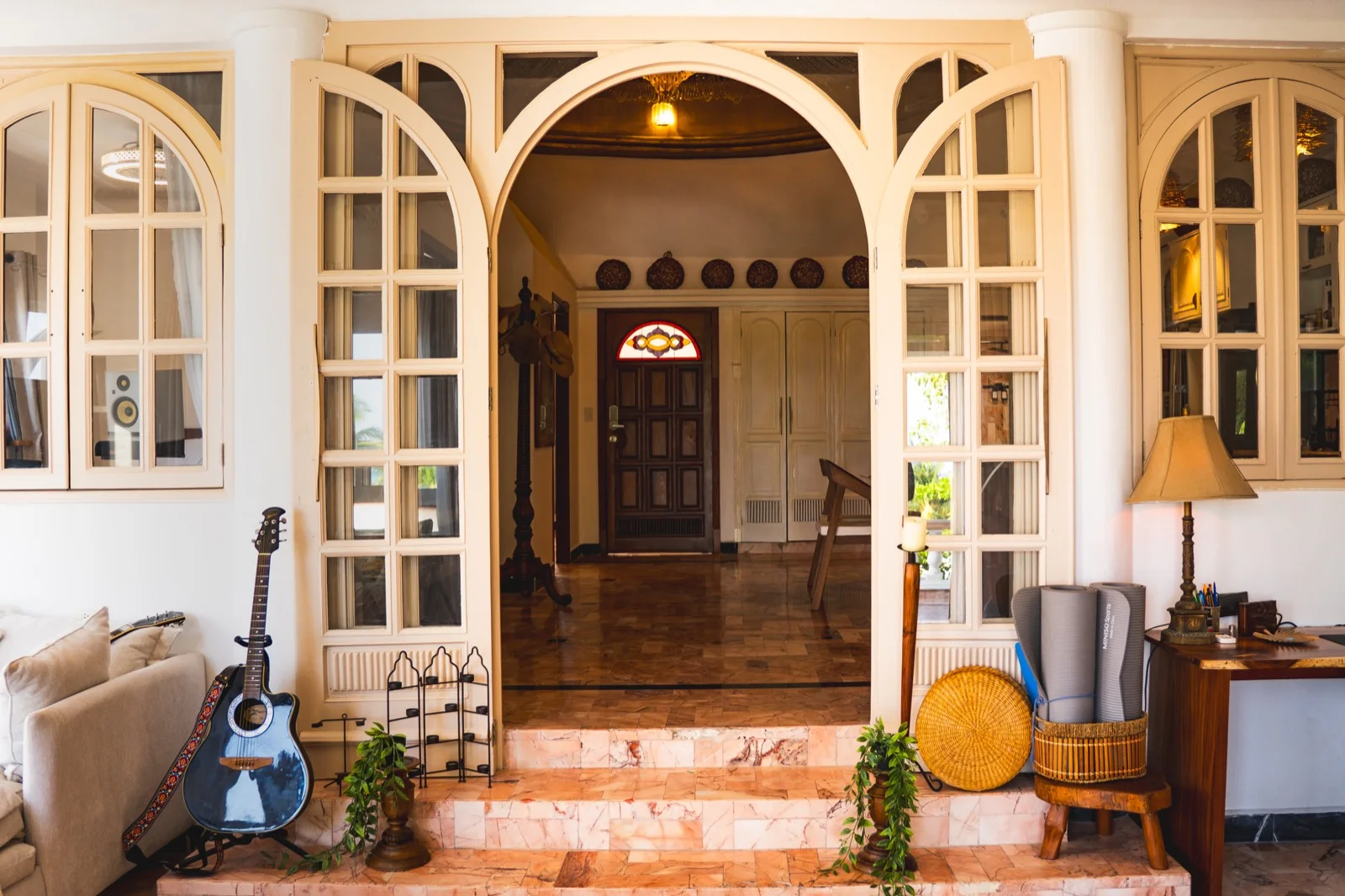 Arched entrance with carved mahogany door
