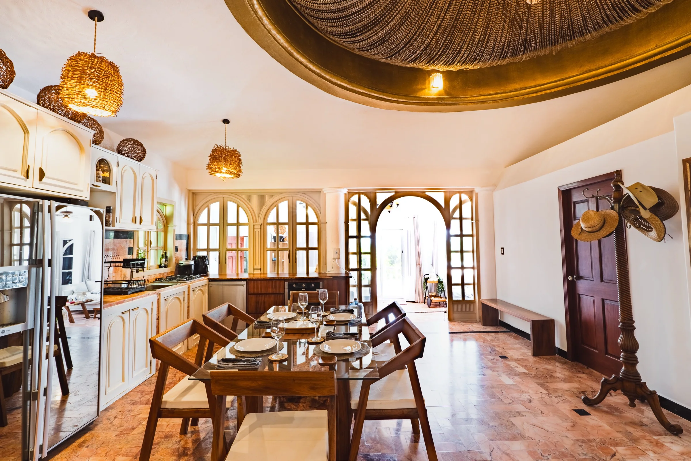 Grand dining room with golden dome ceiling and arched windows